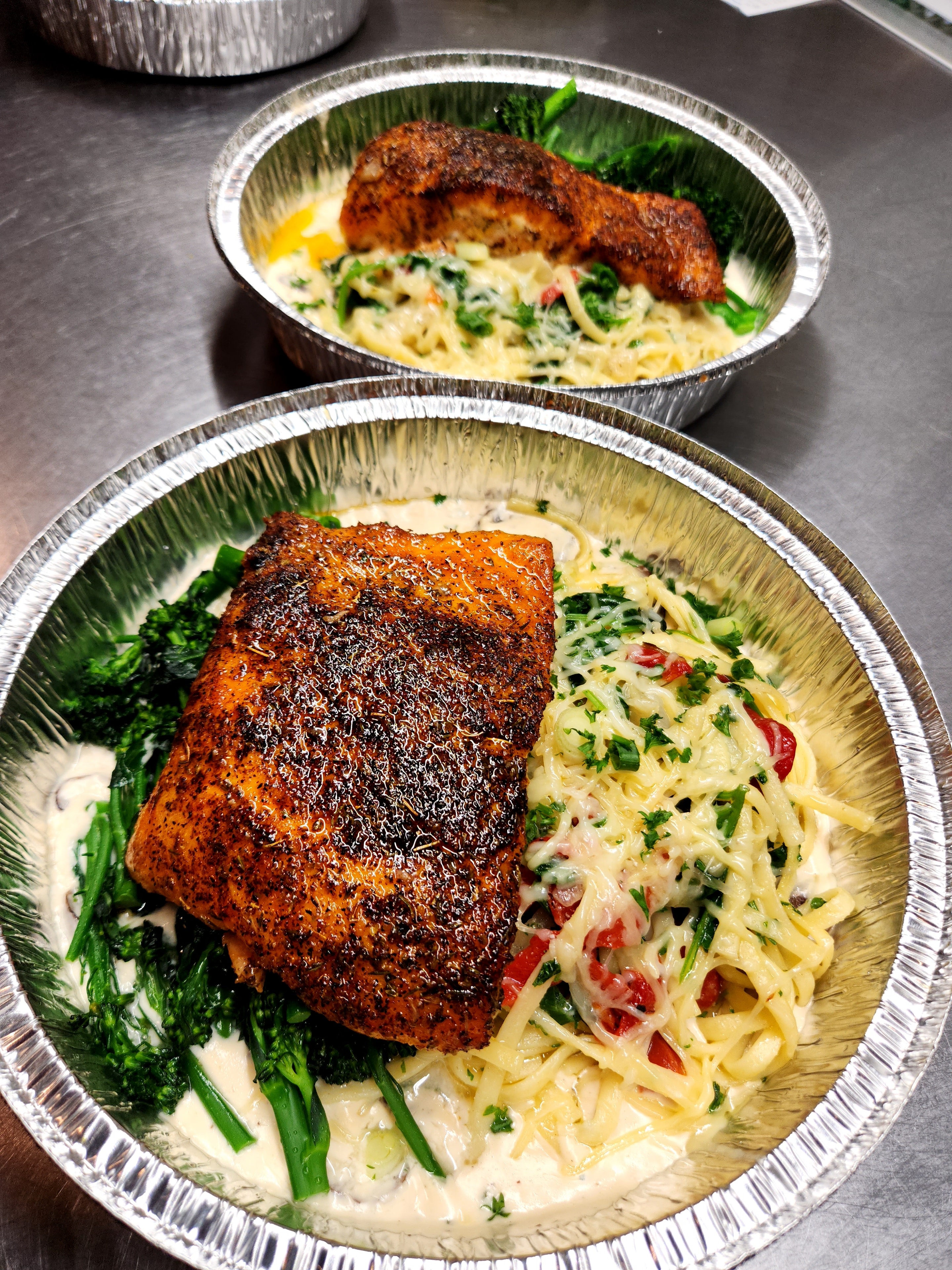 Seared salmon with pasta and greens